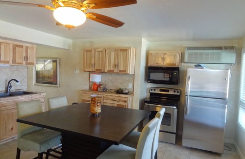 Mount Ida Apartment | Poolside King Cabana with full kitchen, king bed, sleeper sofa and pool access. by RedAwning
