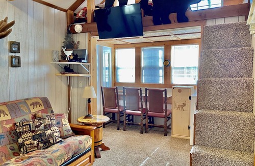 Cosby Cabin | “Porch and Pine” not-so-tiny Tiny Log Cabin