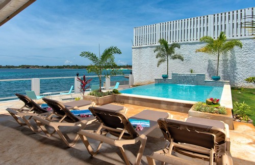 Discovery Bay House | Portside Villa: Private deck and beach access, with amazing views of the ocean