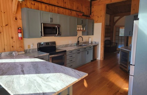 West Baldwin House | Post and Beam House with access to acres of land. Ample parking & new kitchen.