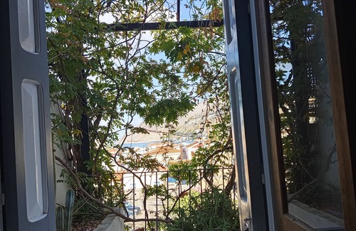 Symi House | Pretty village house with very nice view over Symi harbour from large terraces.