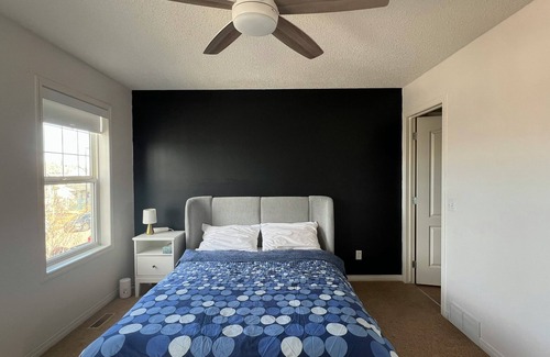 Airdrie House | Private bedroom and bathroom
