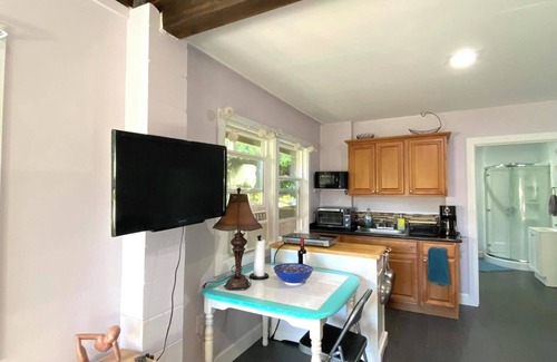 Makaha Apartment | Private, country living modern conveniences. Tropical farm, steps from the beach