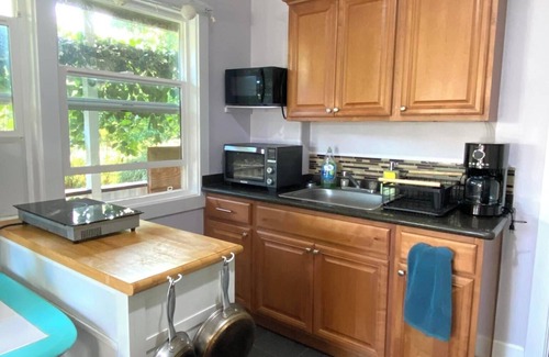 Makaha Apartment | Private, country living modern conveniences. Tropical farm, steps from the beach