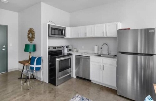 Central City Apartment | Private loft with rooftop deck, fitness center, and private parking.