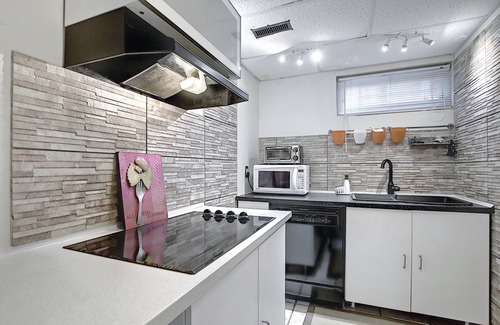 Cedarbrae Apartment | Private lower level suite with fireplace and a feeling of home
