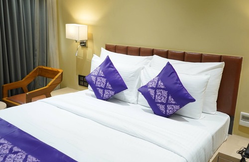 Surat Hotel | Purple Beds by VITS Dwarkesh, Surat