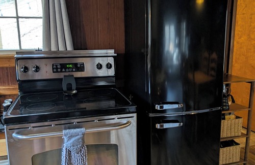 Wooster Cabin | Quaint Newly Remodeled Cabin with Stone Fireplace - Private Hot Tub - King Bed