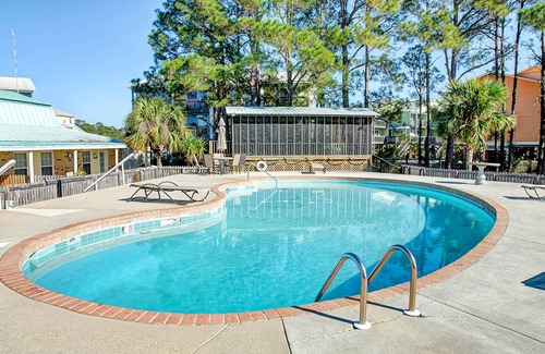 Dauphin Island Condo | Quiet home with WiFi, pool, view of water, & boardwalk to beach