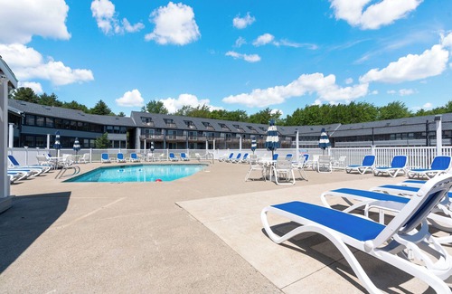 Wells Condo | Refreshing pool view condo at Nautical Mile resort Pool Tennis Courts
