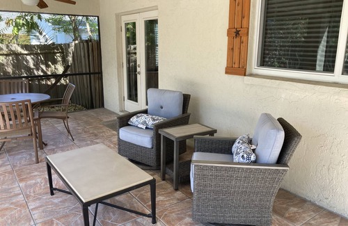 Naples Park House | Relax by the sand at nearby Vanderbilt Beach or hang by heated pool