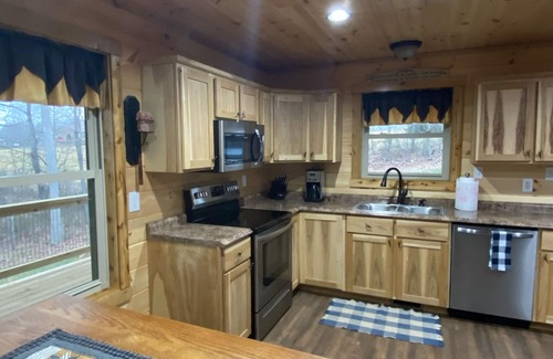 Stanley Cabin | Relax in our secluded hot tub overlooking the pond with a glass of wine