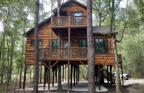 Livingston Cabin | Relax with a view from above in a tree-top getaway! Two Creeks Crossing Resort