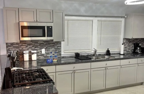 Orange House | Relax with your family in this newly renovated home away from home.