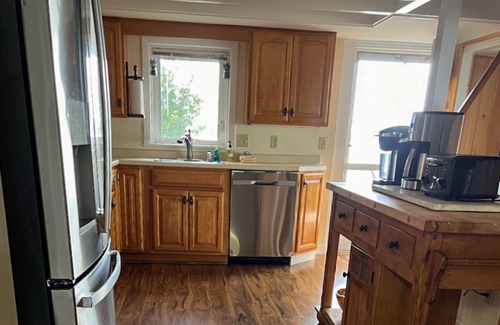 Alton Bay House | Renovated home with a water view, washer/dryer, AC, deck & wood stove