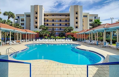 New Smyrna Beach Condo | Resort style amenities in spacious condo with beach access and direct pool view.
