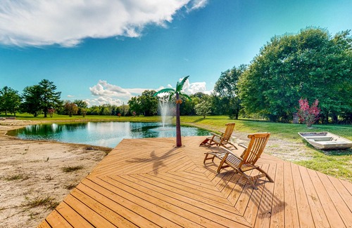 Waller House | Resort-style oasis with swimming pond, beach, tropical hut & bar