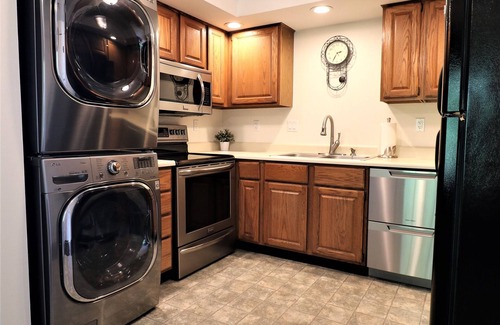Lochmere Condo | Right on the Water at Lake Winnisquam, w/Balcony, Boat Dock, & Sandy Beach