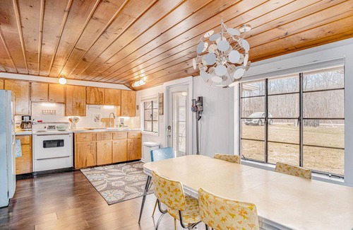 Honor House | Riverfront cabin with furnished deck, beautiful backyard, firepit & kayaks