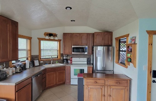 Wimberley House | Romantic hideaway nestled along Lone Man Creek. Views to the falls and hills