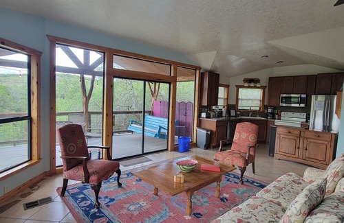 Wimberley House | Romantic hideaway nestled along Lone Man Creek. Views to the falls and hills