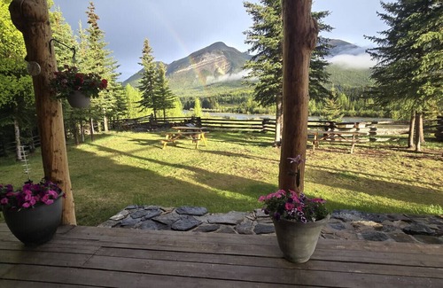 Buckinghorse River Cabin | Room 5 at the Main Lodge with a queen bed and single bed.