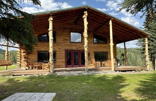 Buckinghorse River Cabin | Room 6 at the Main Lodge with a queen bed and single bed.