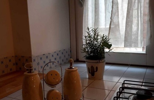 Matera Apartment | Roots - The window in the Sassi