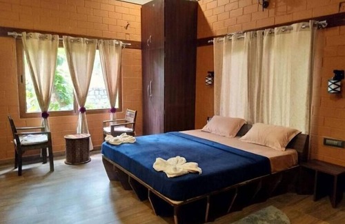 Kaimane House | Rustic Charm Wayanad - Interlocked (Entire studio)