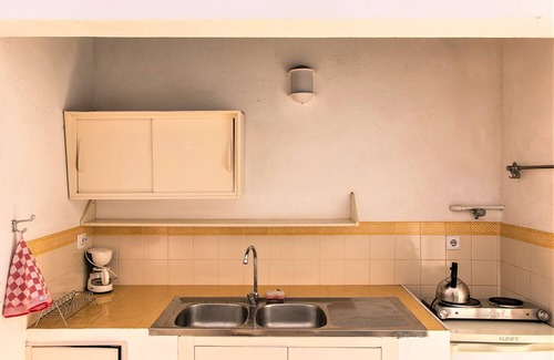 Lagos Cottage | Rustic Family Room with Mezzanine and Large Sun Terrace