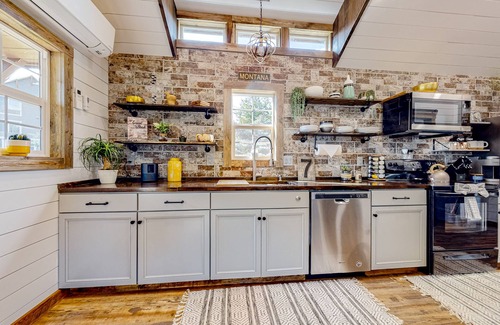 Evergreen House | Rustic getaway with fireplace, patio area, board games, full kitchen, & TV