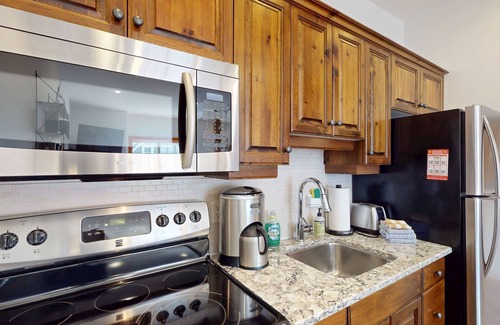 Big White Ski Resort House | Rustic haven w/dog & family-friendly layout w/private hot tub - walk to dining