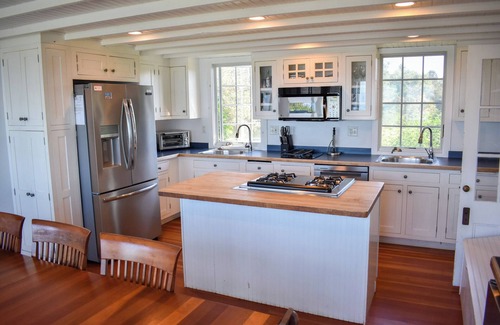 Dennis House | Rustic Oceanfront Retreat with Private Beach and Expansive Deck