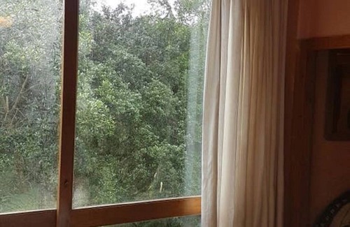 Sao Francisco de Paula House | Rustic Stone House in Condominium.