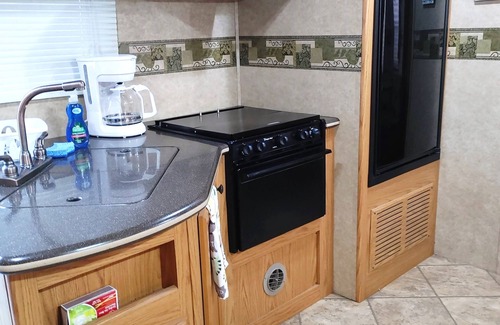 New Smyrna Beach House | RV NSB Sun & Shade Tree, Pool & Picnic RV Vacation