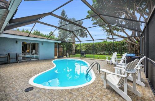 Willoughby Acres House | Salt Water Heated Pool Home with a Tiki Bar, a Garage Game Room and 4 Bikes