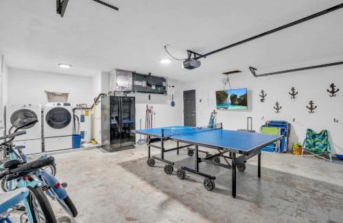 Willoughby Acres House | Salt Water Heated Pool Home with a Tiki Bar, a Garage Game Room and 4 Bikes