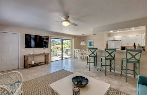 South Island House | Sand Dollar #3: Upstairs Canalfront & Pet Friendly with Pool by the Beach!