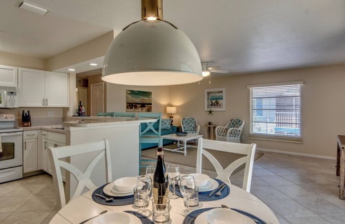 South Island House | Sand Dollar #3: Upstairs Canalfront & Pet Friendly with Pool by the Beach!