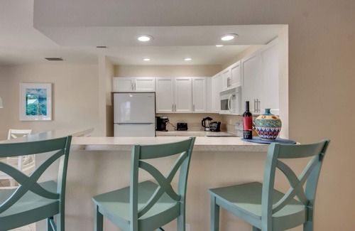 South Island House | Sand Dollar #3: Upstairs Canalfront & Pet Friendly with Pool by the Beach!