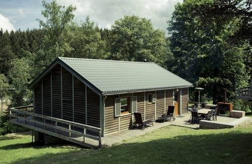 Buellingen Ski Chalet | Scandinavian chalet in lush greenery and forest .