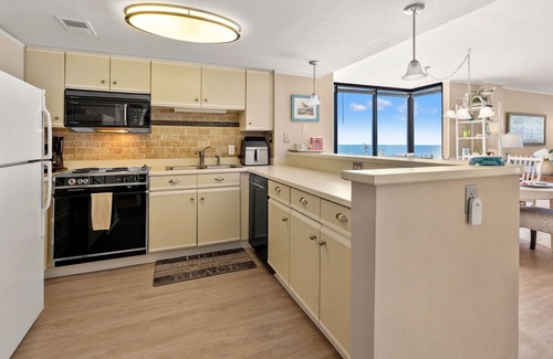 North Myrtle Beach Condo | Sea Pointe 702: End unit with endless shoreline views, overlooking sought-after Cherry Grove Point.