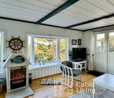 Lillesand House | Seaside cabin with terrace and ocean view