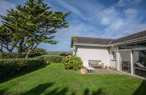 Treator House | Seaside House. Large living area opens onto elevated lawn. 2 mins walk to beach