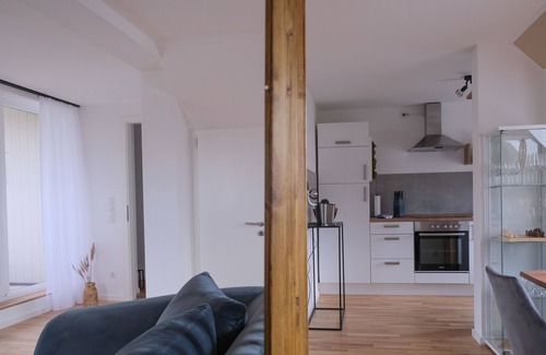 Kahnsdorf Condo | SEE UM'S ECK vacation apartment - modern apartment with loggia directly on Lake Hain