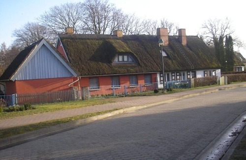 Born auf dem Darss House | Semi-detached house with fireplace near the Bodden, central but quiet location