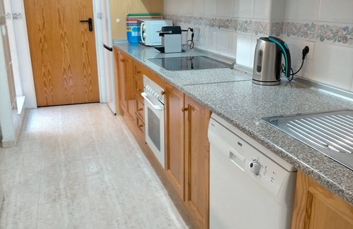 Los Arenales del Sol House | Semi-detached with garden + pool near beach, fiber WiFi + garage. We Speak Engl