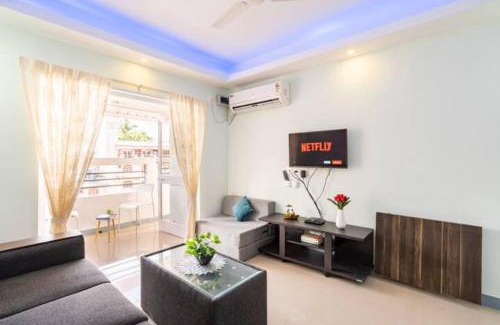 Colva Apartment | Serene Escape One Bedroom Apartment with AC, Wi-Fi, Gym and 5-Minute Walk to the Beach Cativating Tree and Garden Views