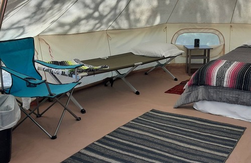 Spring Branch RV Rental | Shady Oaks Glamping Tent Queen Bed, 2 Cots, AC and Electricity