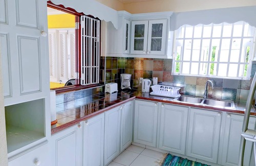Silver Sands Apartment | Silver Sands Beachfront Condo, Indoor & Outdoor Dining, Shared Patio - Bar & BBQ